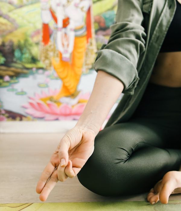 Woman in a calm yoga pose symbolizing inner balance and harmony.